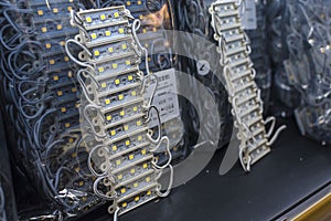 12 volt epoxy LED modules lights on display at an electronics store. An array of light emitting diodes strips