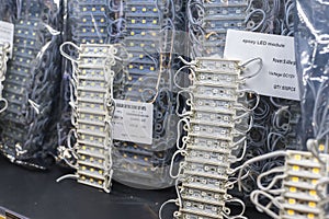 12 volt poxy LED modules lights on display at an electronics store. An array of light emitting diodes strips