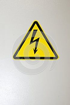 Voltage control sign. High voltage. Caution and warning yellow sign