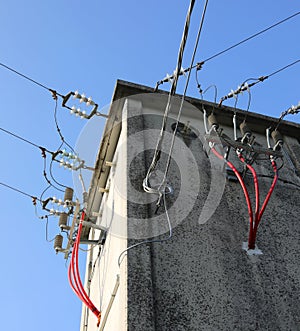 voltage electrical cables in the substation with insulators and photo