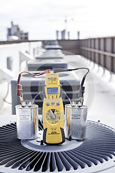 Voltage meter and capacitors