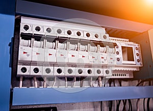 Voltage switchboard with circuit breakers. Modern electrical background.