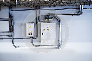 Voltage switchboard with circuit breakers are in the ON and OF positions in the big electric box or electric distributive panel photo