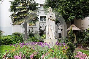 Voltaire's Statue in garden HonorÃ© Champion, Paris