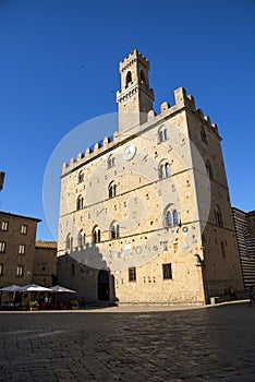 Volterra town central square, medieval palace Palazzo Dei Priori landmark, Pisa state, Tuscany, Italy