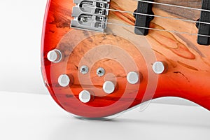 Red bass guitar volume and tone controls