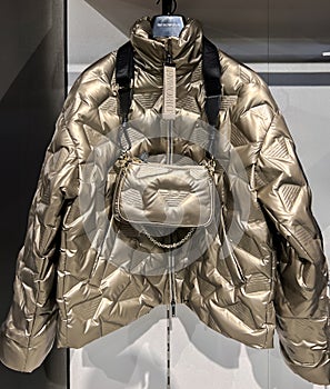 Voluminous and warm golden autumn jacket and handbag from the Emporio Armani