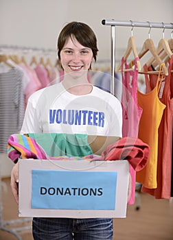 Volunteer with clothes donation box