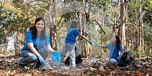 Volunteer collecting plastic trash in the forest. The concept of environmental conservation. Global environmental