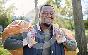 Volunteer, community service and black man cleaning park with garbage bag for a clean environment. Person helping with