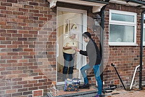 Volunteer Delivering Groceries to the Elderly