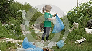 Volunteer girl cleaning up dirty park from plastic bags, bottles. Reduce trash nature pollution