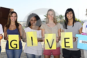 Volunteer group with sign give