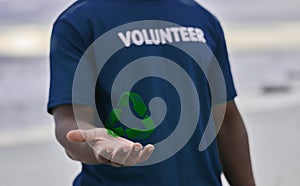 Volunteer, hand and recycle sign with hologram, carbon footprint and save the earth with awareness. Black man, male and