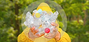 Volunteer hands holding bottle plastic garbage. Environment clean up park cleaning trash nature. Volunteer cleaning