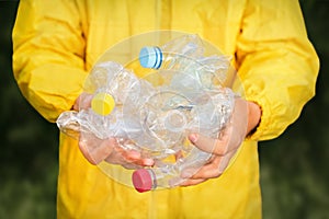 Volunteer hands holding bottle plastic garbage. Environment clean up park cleaning trash nature. Volunteer cleaning