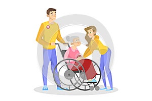 Volunteer help old disabled person in wheelchair