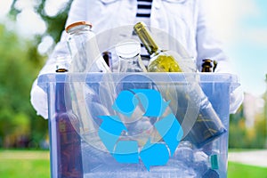 Volunteer holding glass garbage container for recycling