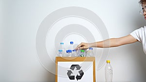 Volunteer keep plastic bottle into paper box at home or office. Hand Sorting Recycle garbage. Ecology, Environmental, pollution,