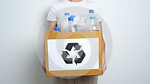 Volunteer keep plastic bottle into paper box at home or office. Hand Sorting Recycle garbage. Ecology, Environmental, pollution,