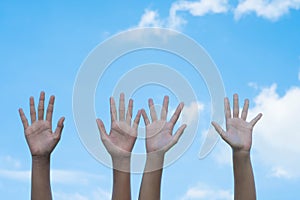 volunteering concept. Hands of people with blue sky on background