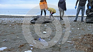 Volunteers clean up trash on the beach in the fall. Environmental issues