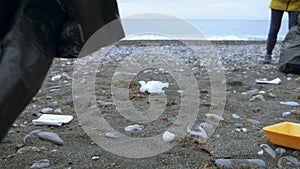 Volunteers clean up trash on the beach in the fall. Environmental issues