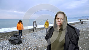 Volunteers clean up trash on the beach in the fall. environmental issues