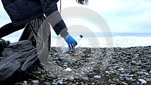 Volunteers clean up trash on the beach in the fall. environmental issues