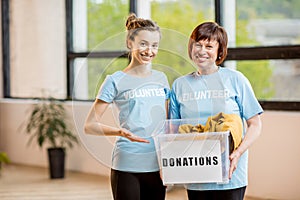 Volunteers with donation box