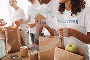 Volunteers packing food and drinks for charity