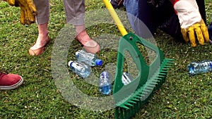 Volunteers picking up garbage in park