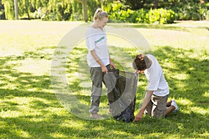 Volunteers picking up litter in park