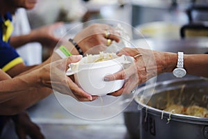 Volunteers Share Food to the Poor to Relieve Hunger: Charity concept