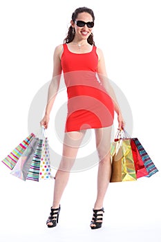 Voluptuous long legged woman holds shopping bags