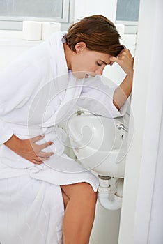 Vomiting, pregnant woman and morning sickness in bathroom, nausea and hand on stomach. Mirror reflection, moody and