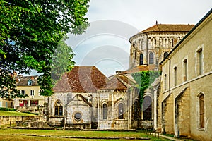 The apse of the church of Notre-Dame and some monastic buildings in the town of la CharitÃÂ© sur Loire, France. photo