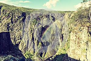 Voringsfossen waterfall with rainbow, Norway