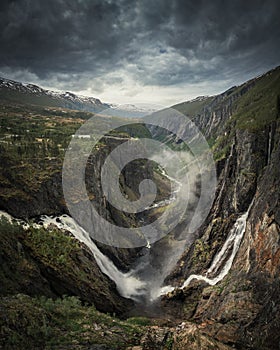 Voringsfossen waterfall in a valley at Hardangervidda National Park from above in Norway