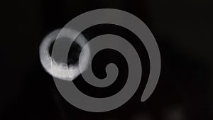 Vortex rings moving towards screen in a dark background, macro close up slow motion isolated