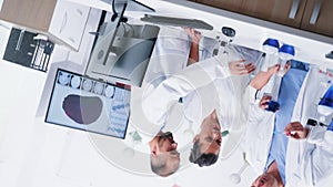 Vortex spinning shot of team of scientists in modern laboratory