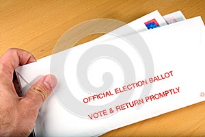 Voter receiving ballot in mail photo