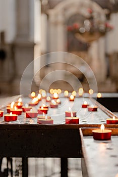 Votive candles in an Italian church