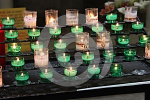 Votive candles were lit in a church (France)