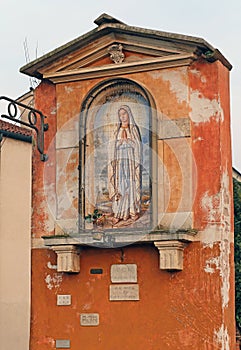 Votive capitals with the image of the madonna in Italy