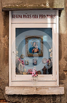 Votive wall shrine dedicated to the Virgin Mary, popular devoutness