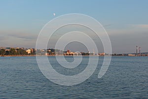 Votkinsk town at sunset with moon