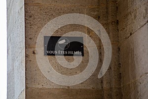 vous etes filmes french text and cctv sign icon means you are filmed in wall building photo