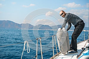 Voyage race sail on professional sport sea yacht. Mooring fender. Yachting summer vacation cruise. Captain yachtsman