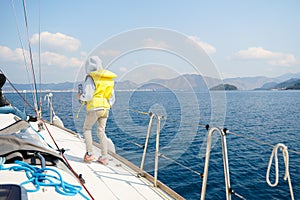 Voyage sail on sport sea luxury yacht. Yachting family summer vacation cruise. Children, sailor kid girl sailing in